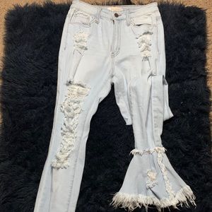 Flared light washed ripped jeans